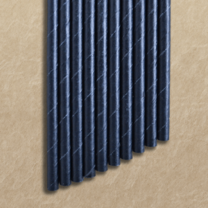 black paper straws lying on kraft paper background